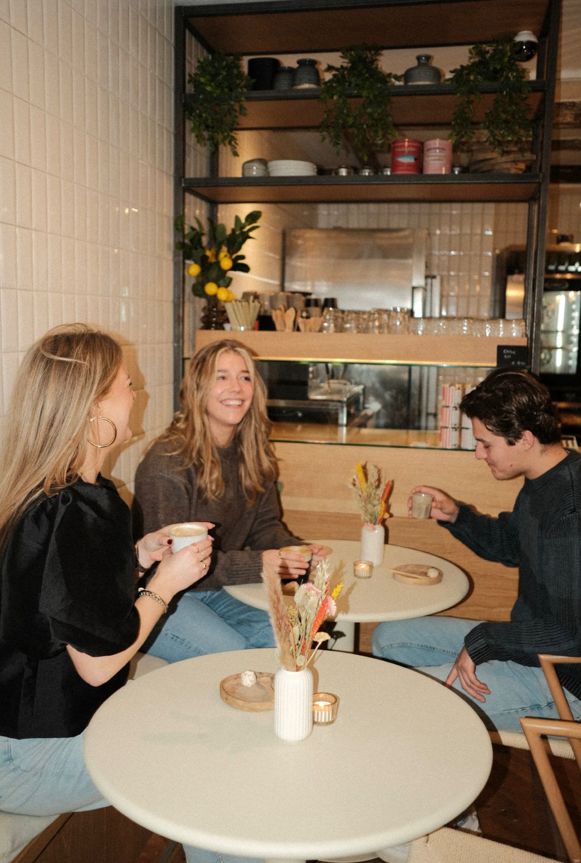 Guests smiling and drinking coffee